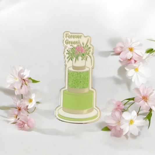 Close-up of Green Three-Tier Cake Enamel Pin showing intricate floral pattern and silver accents - High-quality hard enamel finish with sparkle details