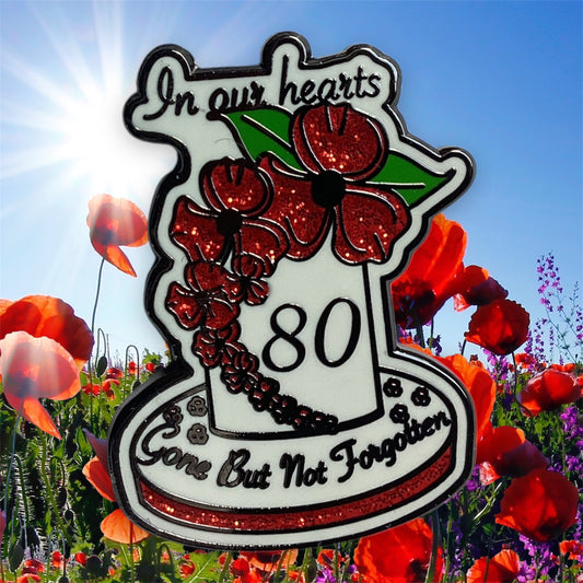 Close-up of VE Day 80th Anniversary Poppy Enamel Pin showing detailed red petals and black center - High-quality hard enamel finish with commemorative design
