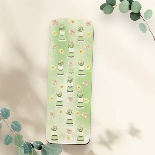 Green tiered cake bookmark with delicate floral pattern and silver embellishments, front view"