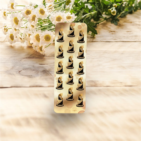 Elegant leopard print bookmark featuring luxurious black and gold cake tier design, front view"