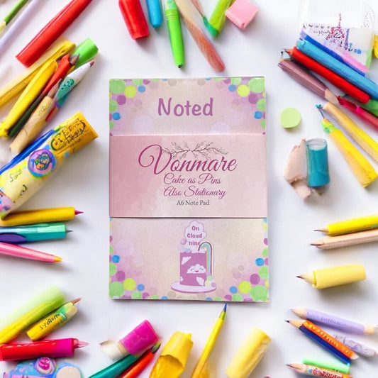 A6 Rainbow Notepad - Close-up View - Premium Quality Paper with Cheerful Pink and Rainbow Pattern"