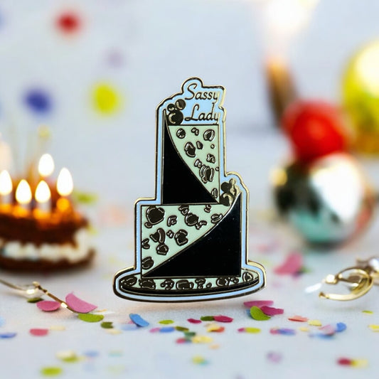 Sassy Lady Leopard Print Enamel Pin worn on clothing - Gold and black leopard cake design pin showing how it elevates outfit style