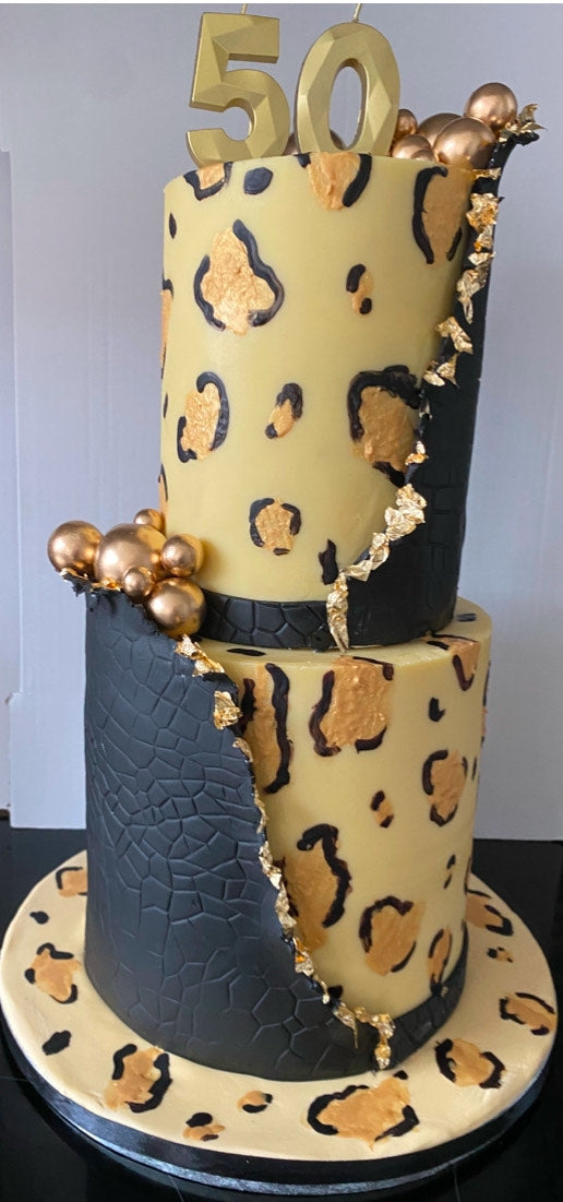 Close-up of Sassy Lady Leopard original cake showing intricate gold and black leopard pattern details and high-quality finish
