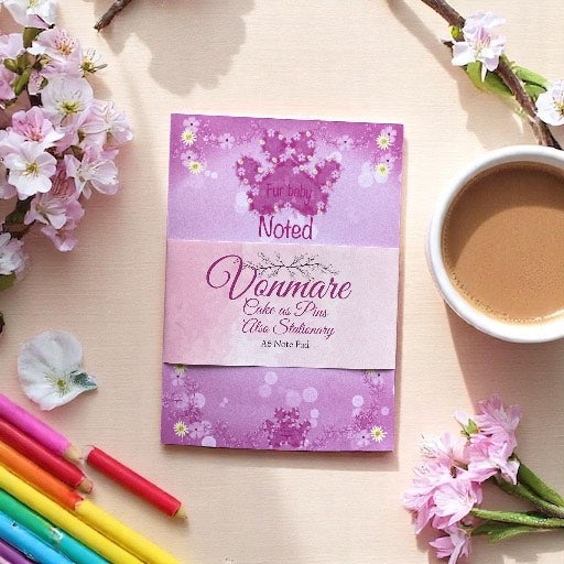 "Pink paw print A6 hardback notepad with durable binding and feminine design, ideal for daily journaling"