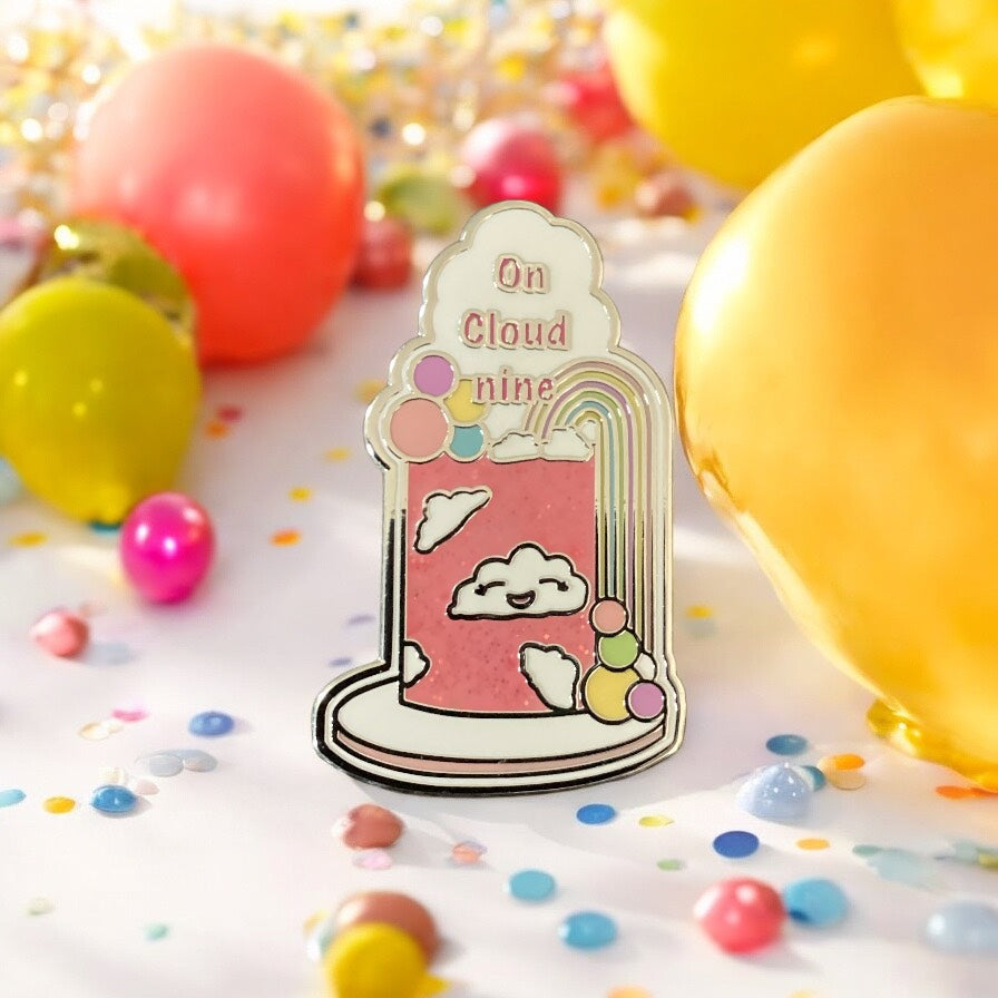 On Cloud Nine Enamel Pin displayed on clothing - Pink rainbow and cloud design pin showing how it looks when worn as an accessory