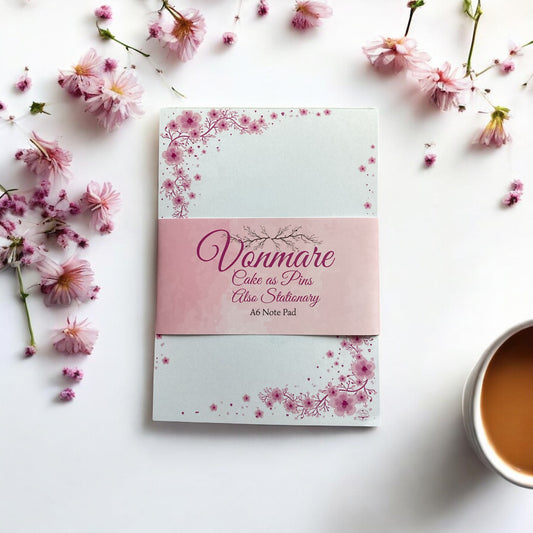 "Close-up view of Pink Blossom A6 Notepad showing high-quality pages and elegant pink floral cover design"